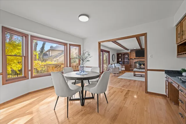 a view of a dining room with furniture and a large window