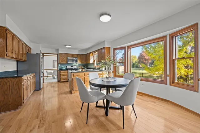 a dining room with furniture and wooden floor