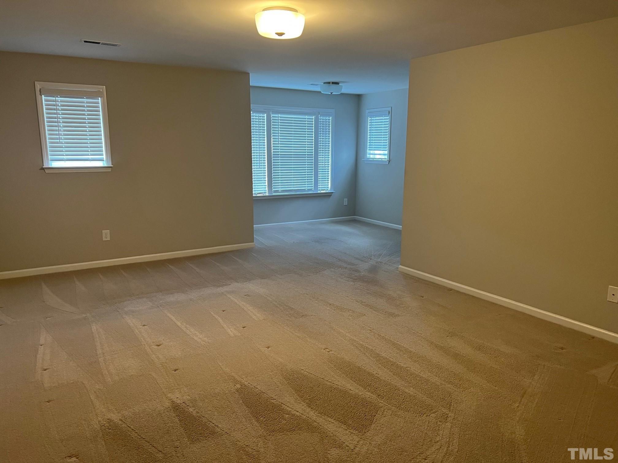 562 Metro Station Apex, NC 27502 - Photo 11 of 19 an empty room with windows