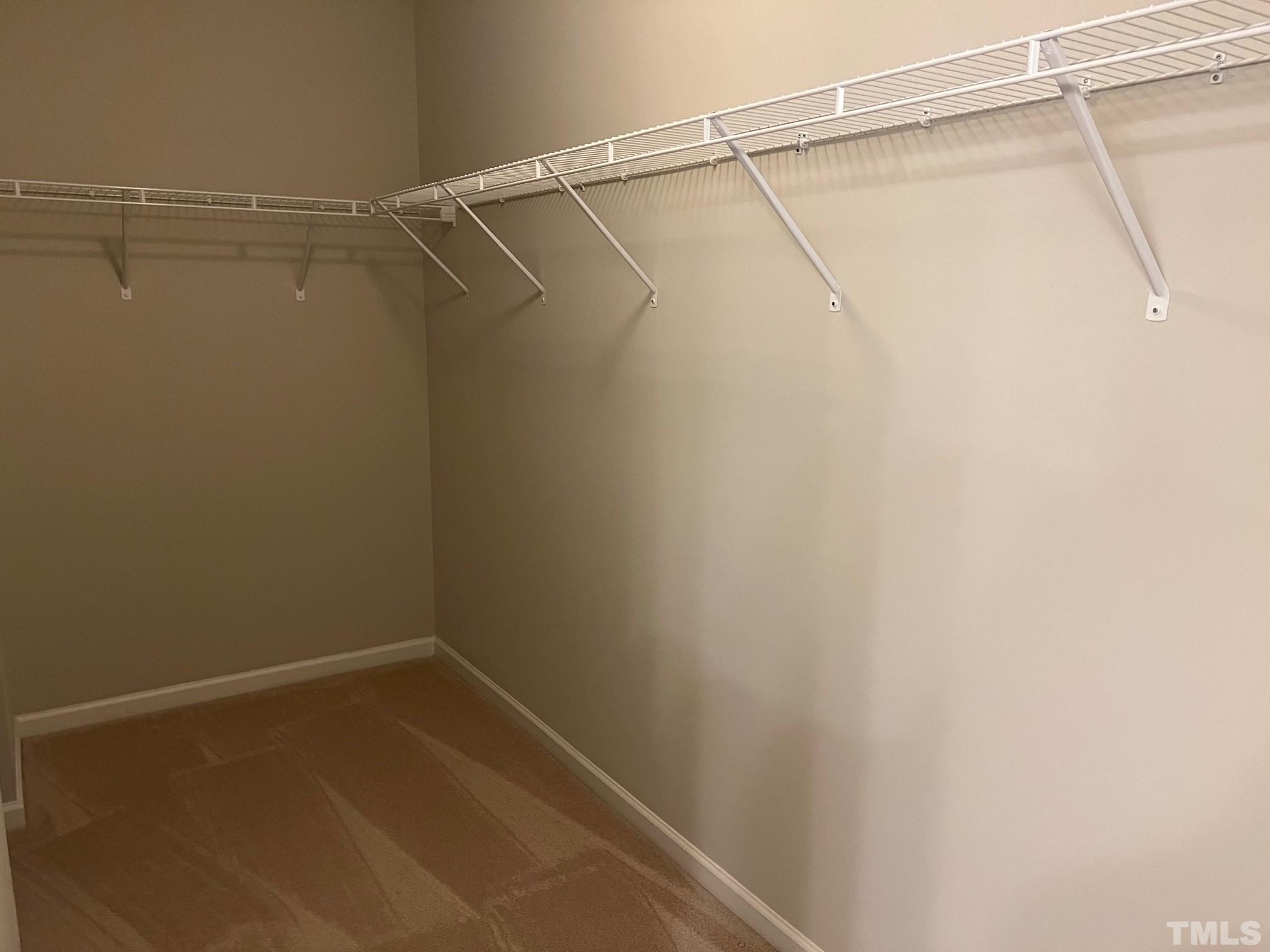 562 Metro Station Apex, NC 27502 - Photo 14 of 19 a view of a room with racks on the wall