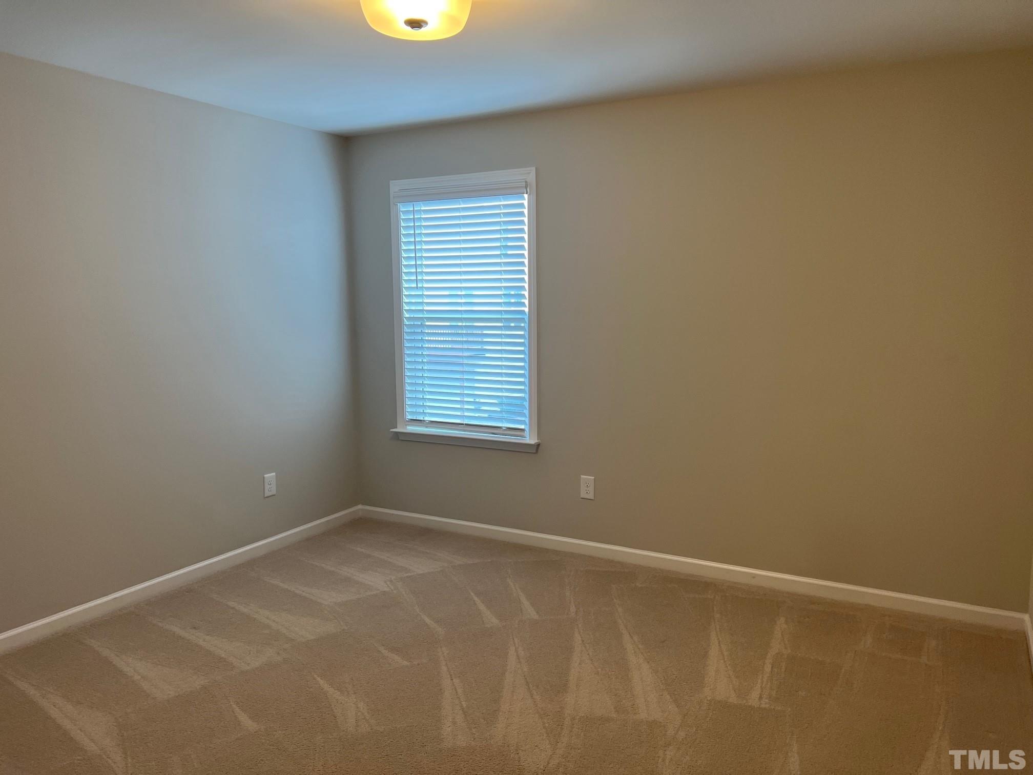 562 Metro Station Apex, NC 27502 - Photo 15 of 19 an empty room with a window