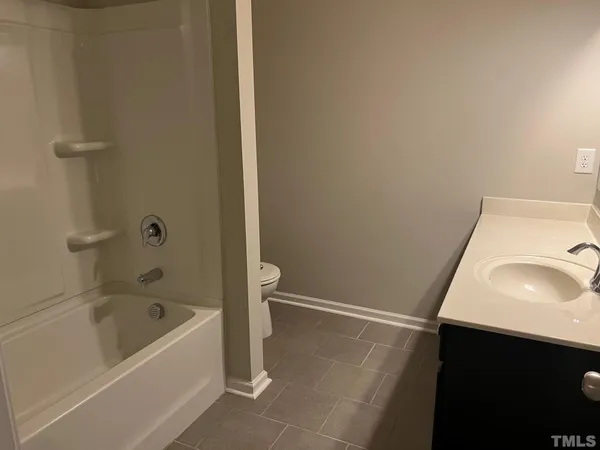 a bathroom with a sink and a bathtub