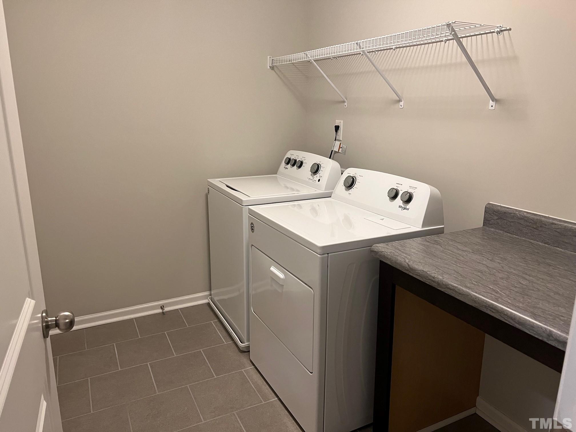 562 Metro Station Apex, NC 27502 - Photo 18 of 19 a utility room with dryer and washer