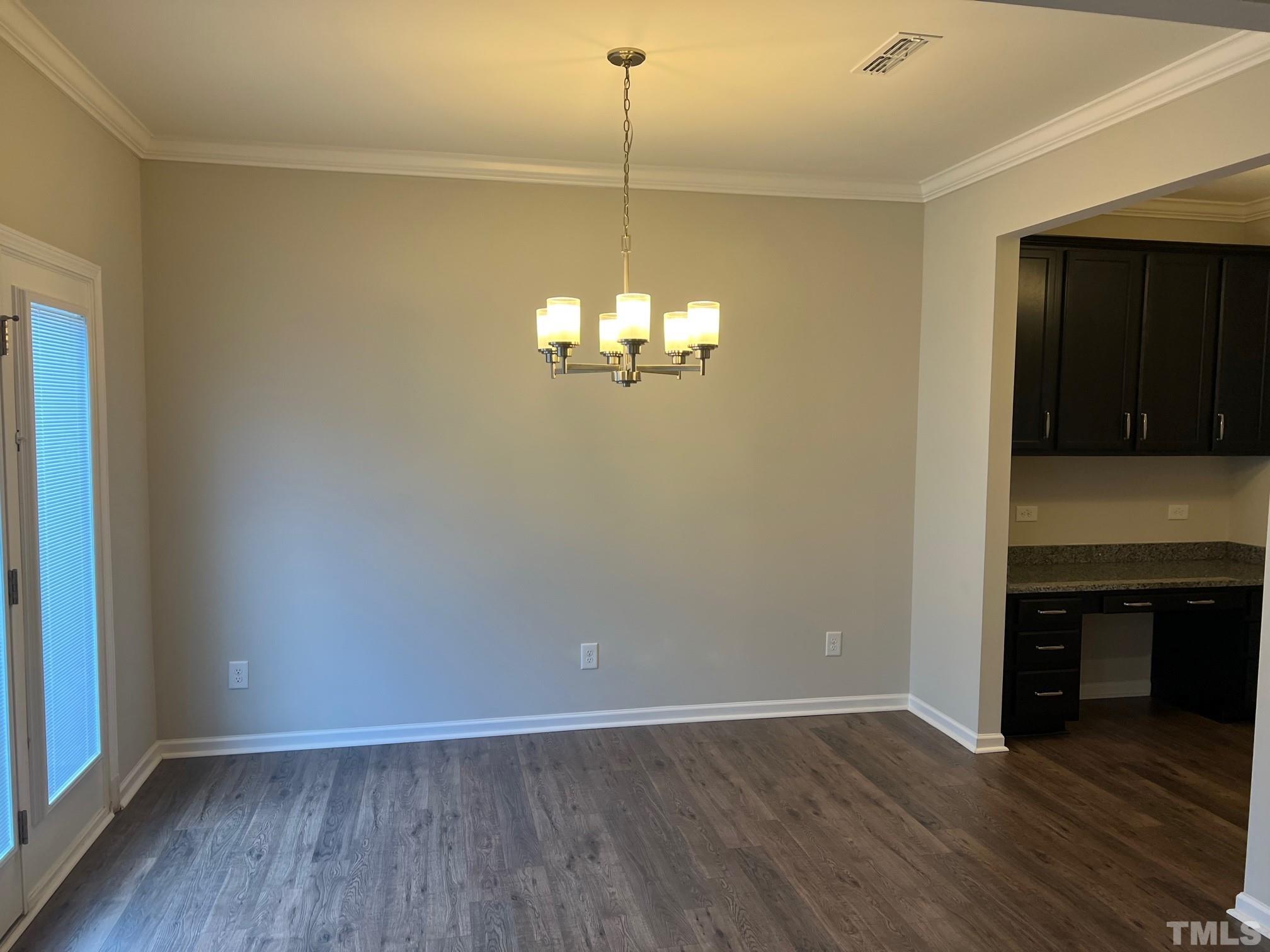562 Metro Station Apex, NC 27502 - Photo 6 of 19 a view of a room with wooden floor and fireplace