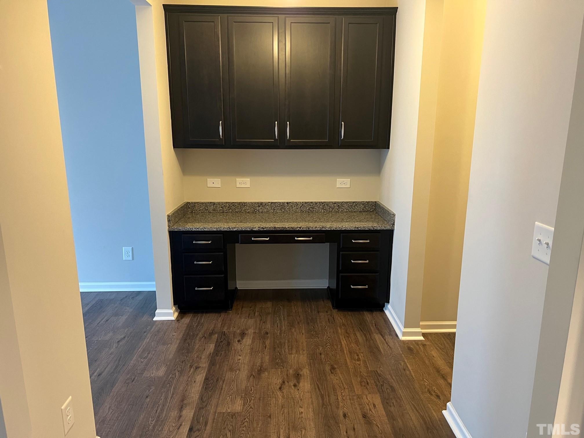 562 Metro Station Apex, NC 27502 - Photo 7 of 19 a view of an empty room with wooden floor