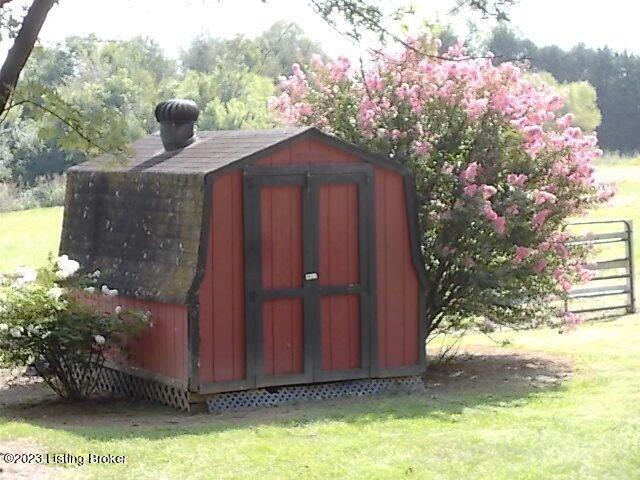 340 Holy Cross Road Loretto, KY 40037 - Photo 33 of 37 Storage shed for pool equipment