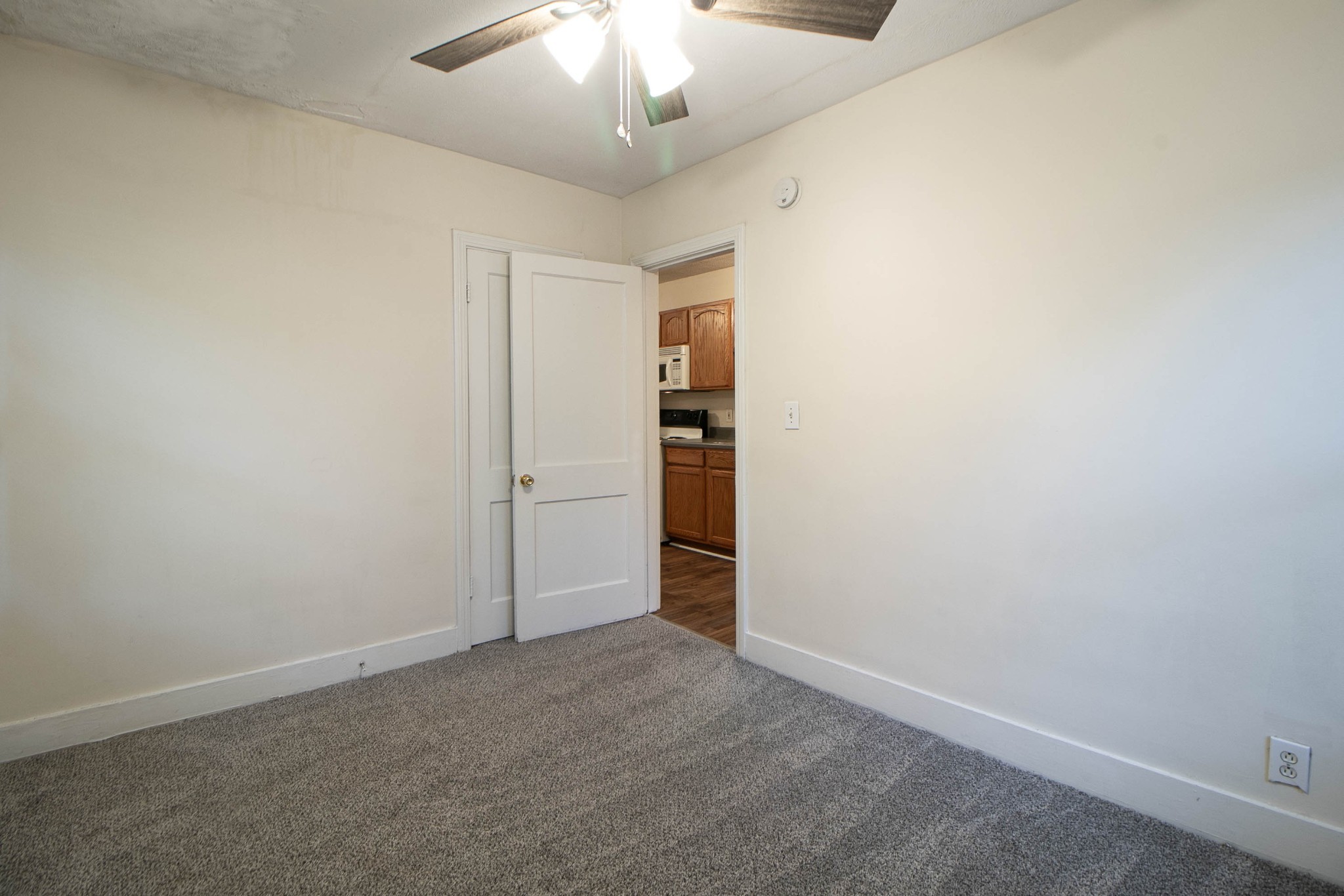 802 Robb Avenue, Unit B Clarksville, TN 37040 - Photo 12 of 15 an empty room with an empty space and a ceiling fan