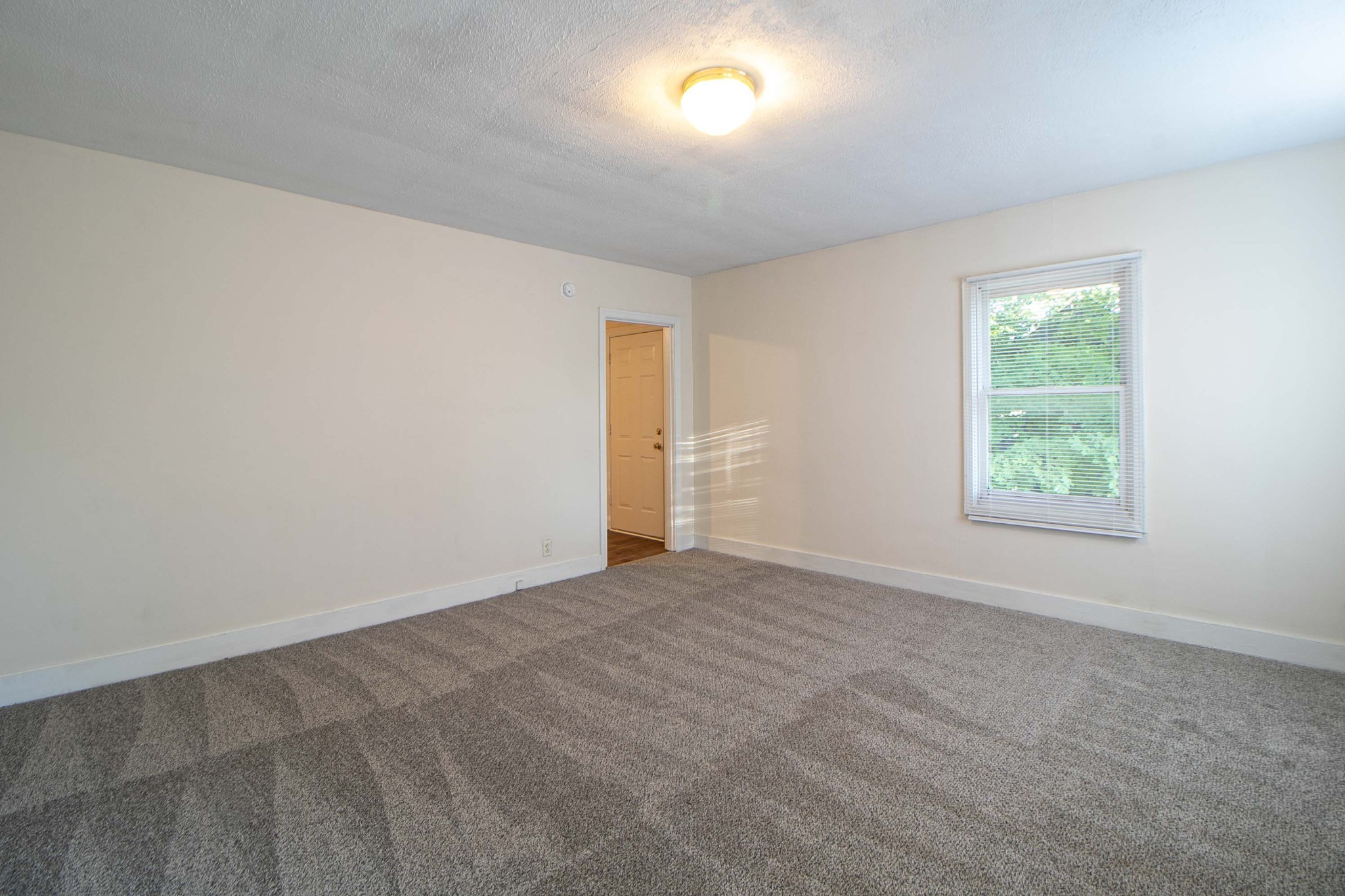 802 Robb Avenue, Unit B Clarksville, TN 37040 - Photo 2 of 15 an empty room with windows