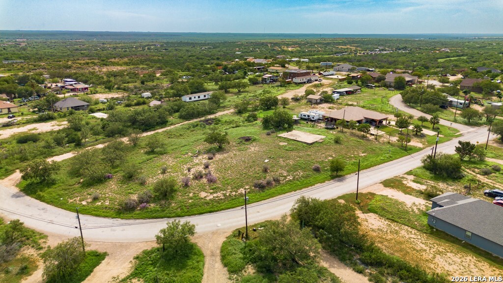 1326 Wagon Wheel Road Eagle Pass, TX 78852 - Photo 9 of 17 an aerial view of residential houses with outdoor space and trees