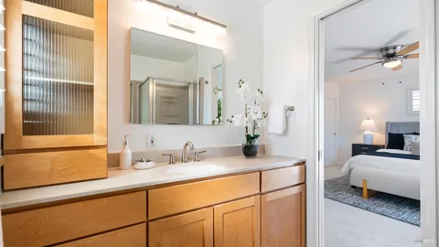 a en suite bathroom with a sink and a mirror