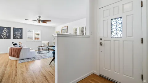 a view of livingroom with furniture window and wooden floor