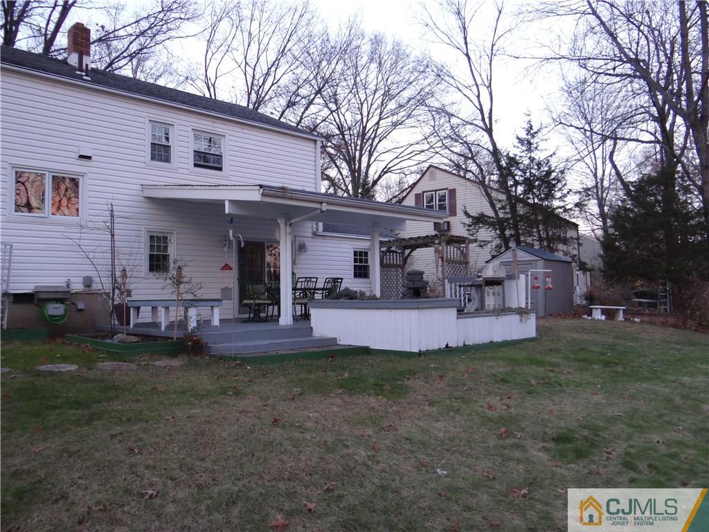 9 Hill Road Edison, NJ 08817 - Photo 3 of 16 a view of a house with a yard and a tree