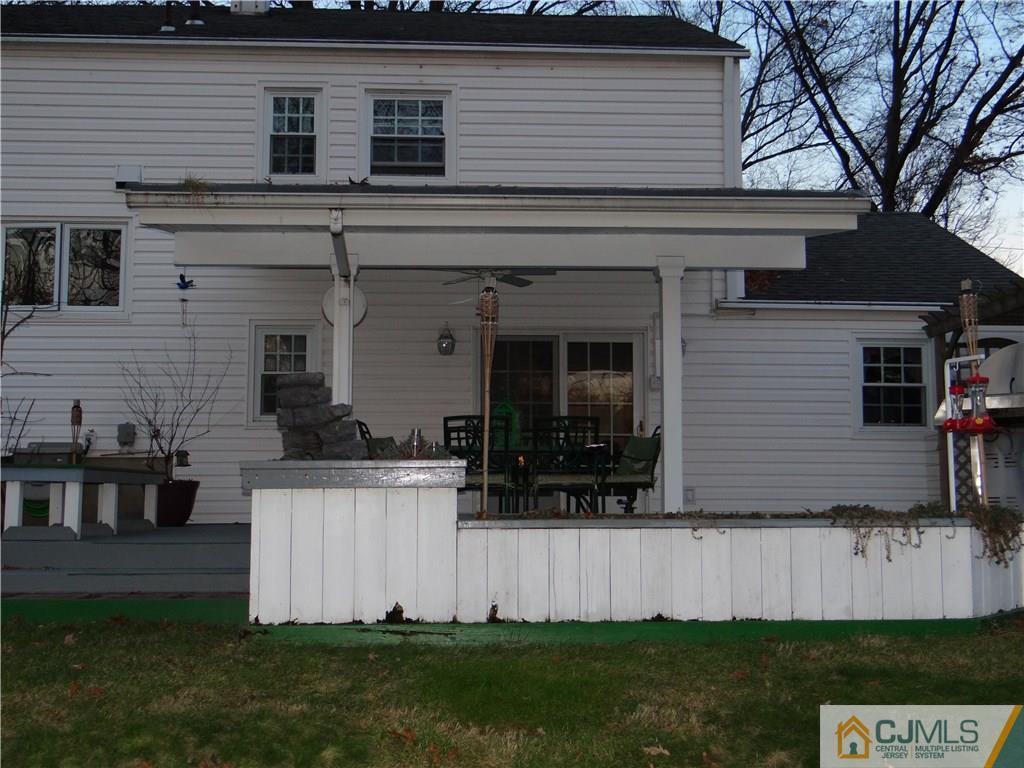 9 Hill Road Edison, NJ 08817 - Photo 4 of 16 a front view of a house with a yard