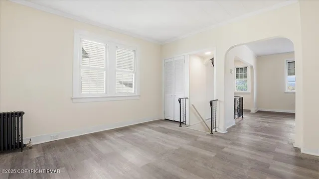 a kitchen with white cabinets and appliances