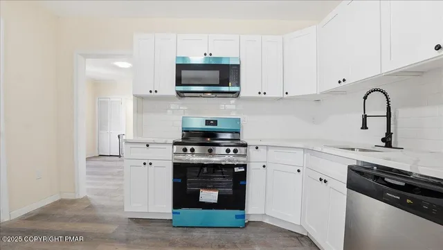 a view of a small space with wooden floor