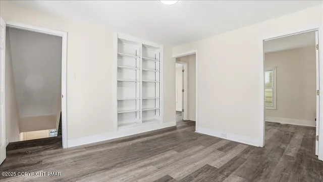 a view of a room that has a window in it