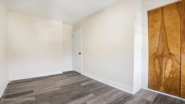 an aerial view of residential building with parking