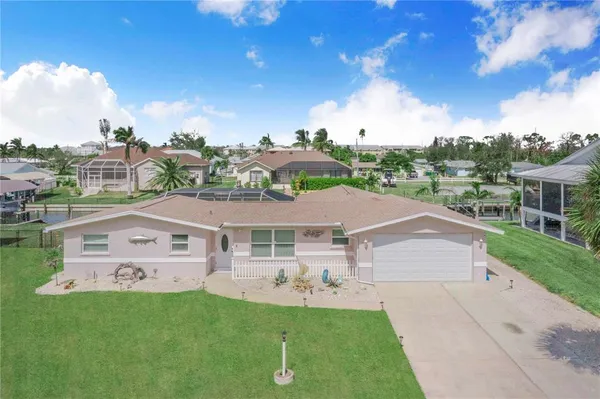 aerial view of a house with a yard