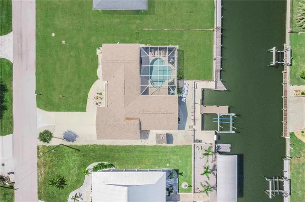 a dining room with furniture a garden and patio