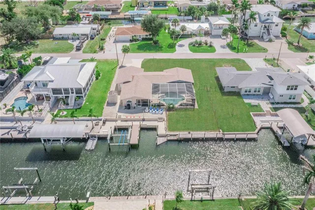 a view of a swimming pool with a porch and furniture