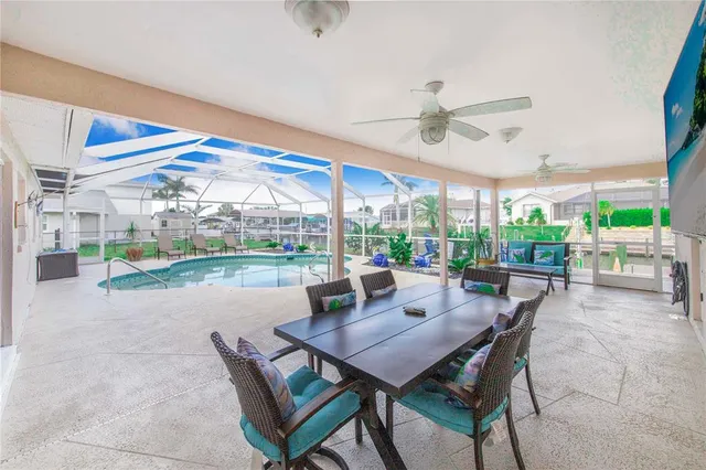 a view of a lake with couches chairs