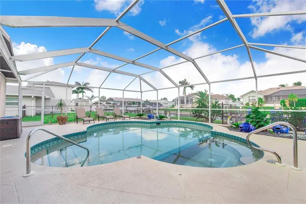 a view of a chair and table in the patio