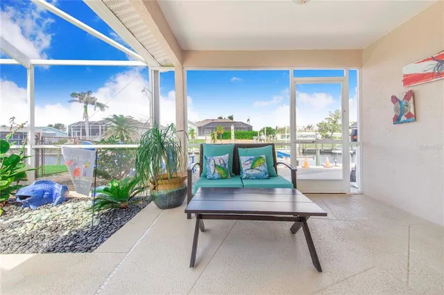 a view of a lake with couches chairs