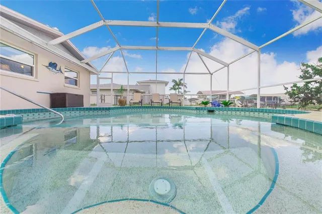 a view of a dining room with furniture and a floor to ceiling window