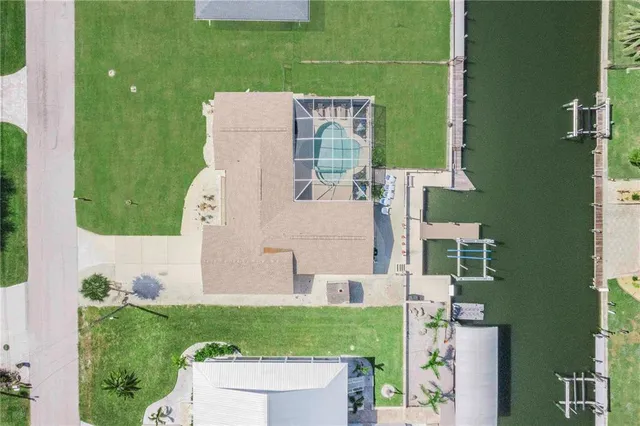 aerial view of a house with a yard