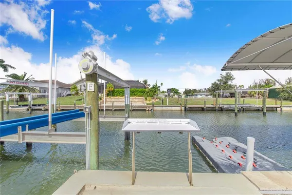 a kitchen with stainless steel appliances kitchen island granite countertop a refrigerator and microwave
