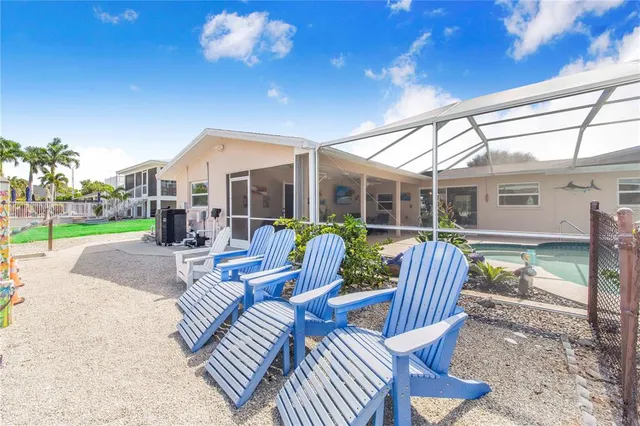 a bedroom with a bed dresser and window