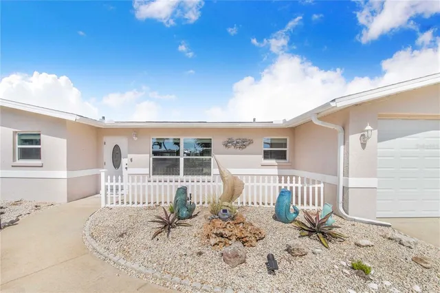 a bedroom with furniture and a flat screen tv