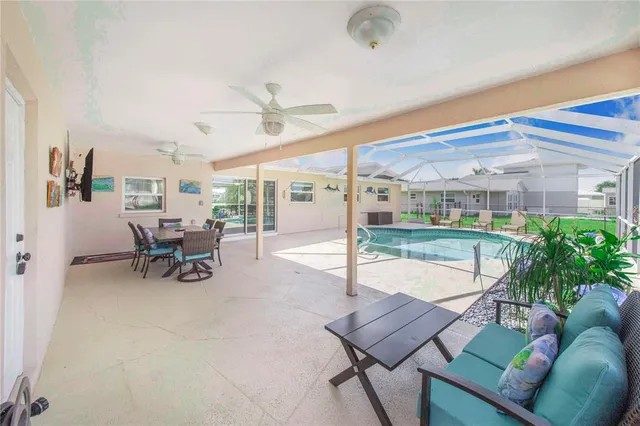 a bedroom with a bed a dresser and painting on the wall