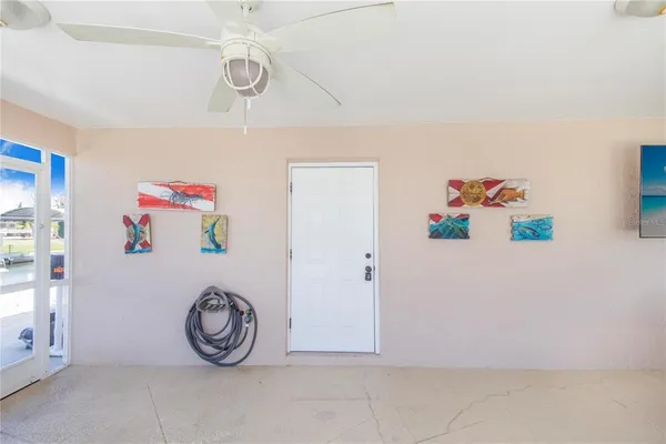 a bathroom with a granite countertop sink mirror vanity and toilet