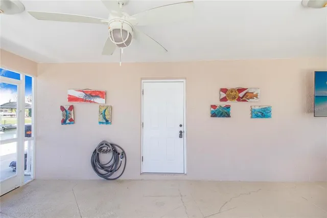 a bathroom with a granite countertop sink mirror vanity and toilet
