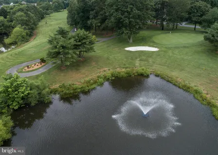 a view of a lake with a yard