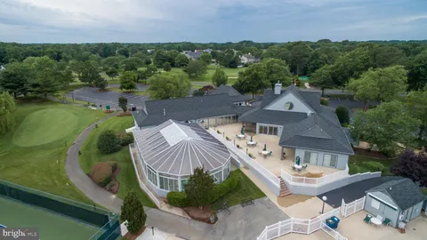 an aerial view of a house with outdoor space and street view