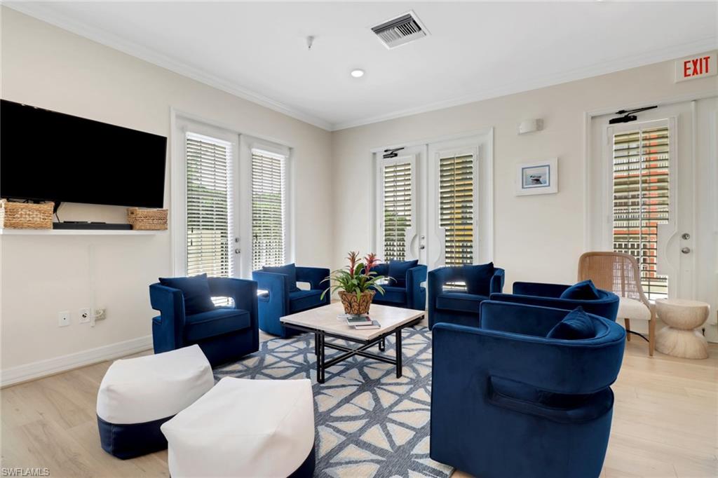 401 Bayfront Place, Unit 3207 Naples, FL 34102 - Photo 20 of 22 Living area featuring light wood-type flooring, ornamental molding, plenty of natural light, french doors, and recessed lighting