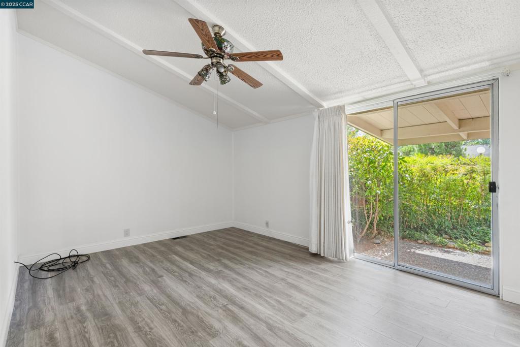 1201 Monument Boulevard Concord, CA 94520 - Photo 17 of 23 wooden floor in an empty room with a window