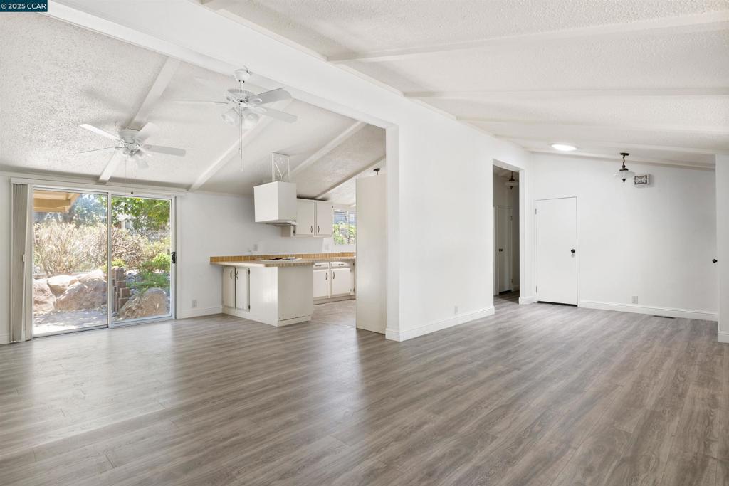 1201 Monument Boulevard Concord, CA 94520 - Photo 5 of 23 wooden floor in an empty room with a window