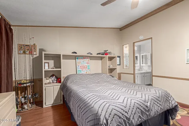 a bedroom with a large bed and a tv