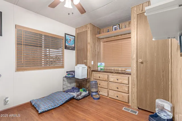 a bedroom with a bed and a dresser in it