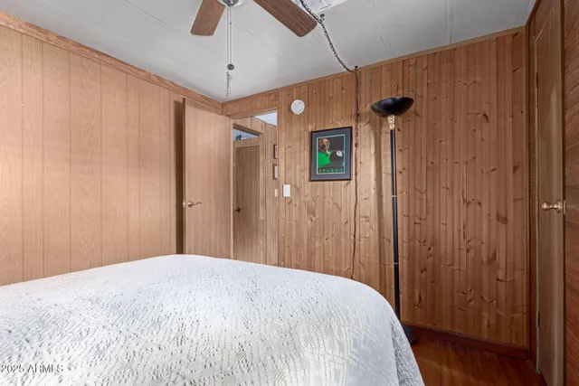 a bedroom with a bed and a table