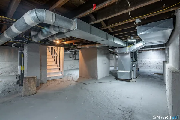 a view of empty room with wooden walls