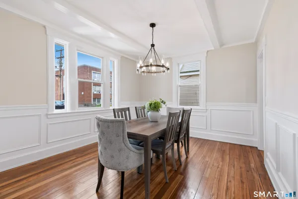 a dining room with furniture window wooden floor