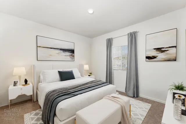 a kitchen with stainless steel appliances a refrigerator a stove a sink a dining table and chairs