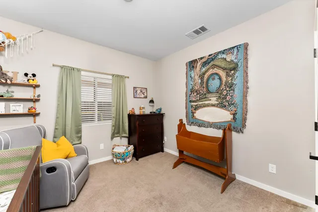 a dining room with furniture and a window