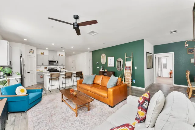 a view of a patio with a dining table and chairs