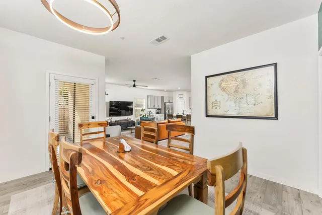 a view of a house with swimming pool and a yard