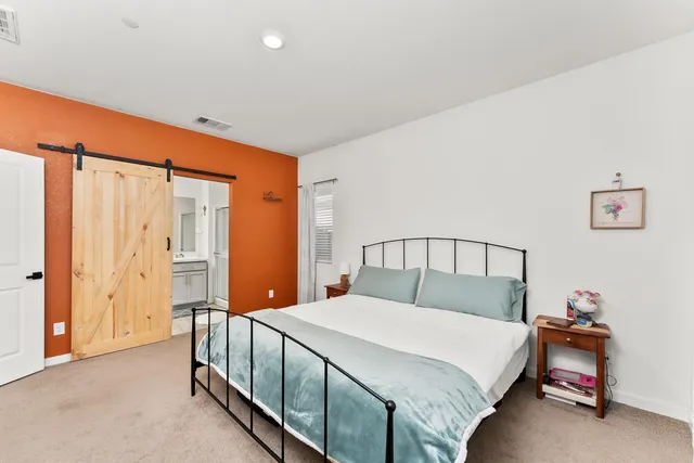 a view of swimming pool with outdoor seating and plants